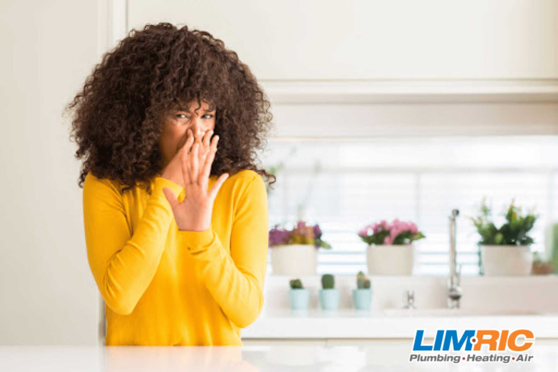 Woman holding her nose because of smelly bathroom sink.