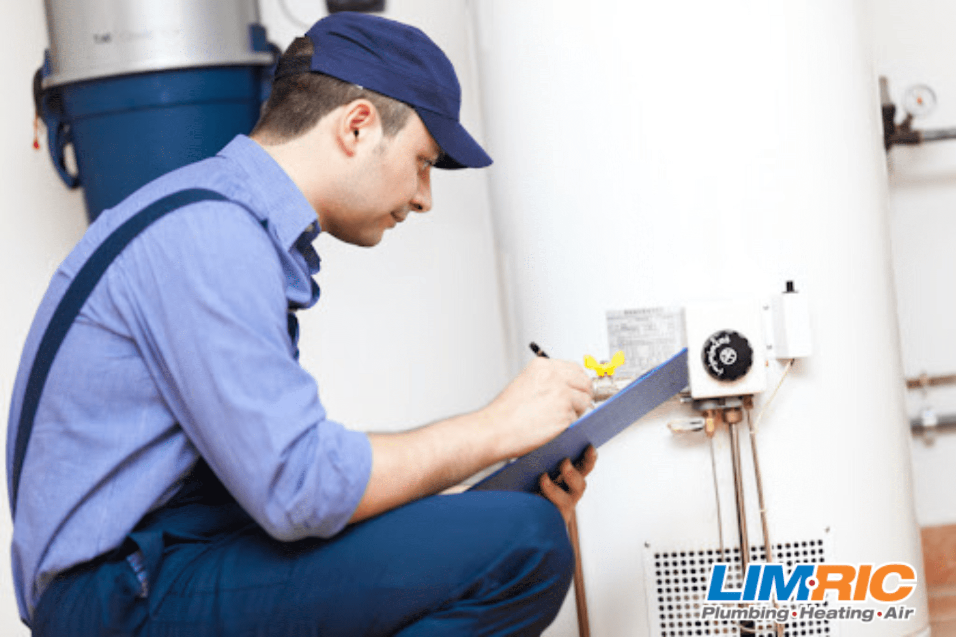 A LimRic technician inspecting a water heater.